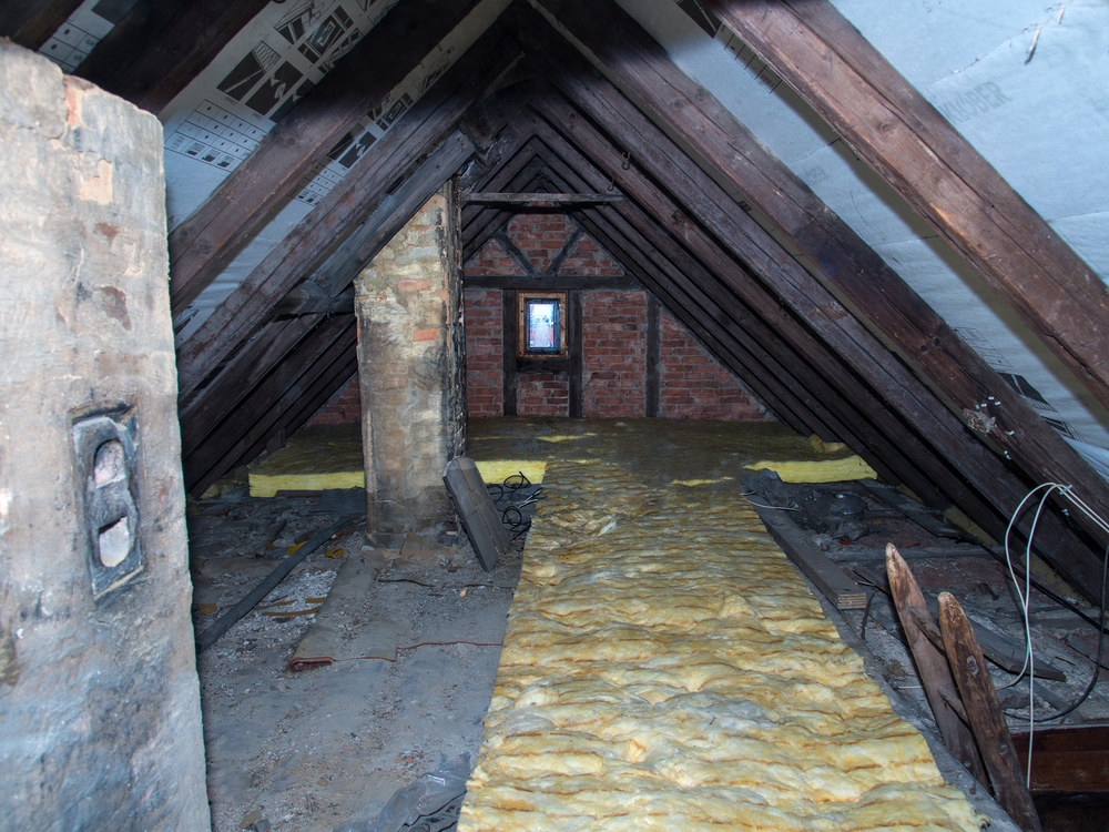 Dave´s Insulation of Washtington DC inspecting an attic that requires an upgrade